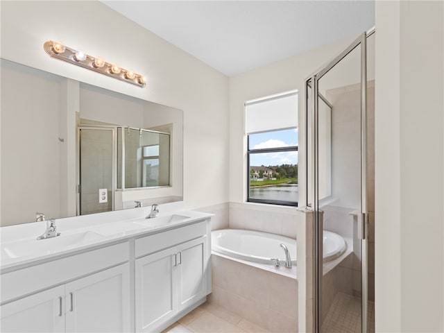 bathroom with tile patterned flooring, vanity, and plus walk in shower