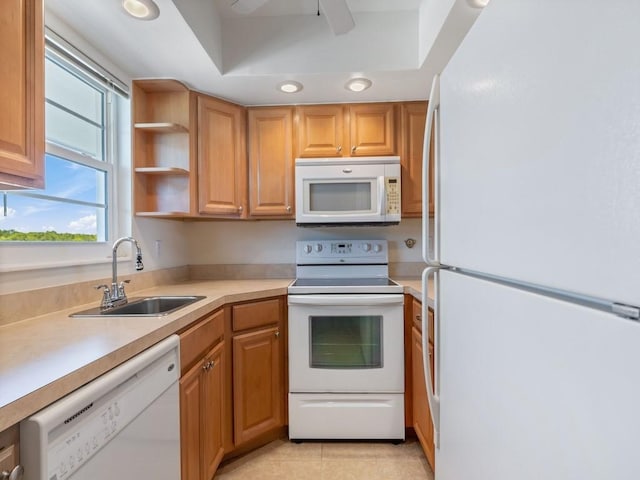 kitchen featuring ceiling fan, sink, light tile patterned floors, and white appliances