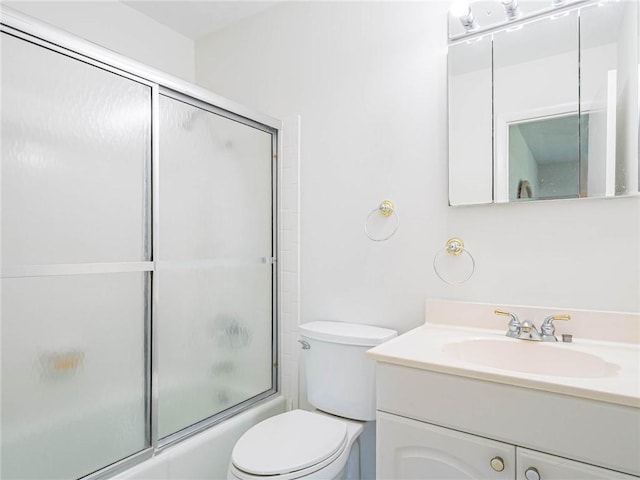 2800 Indian River Blvd Unit L8, Vero Beach, FL 32960 - full bathroom with bath / shower combo with glass door, toilet, and vanity