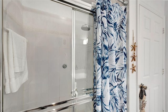 full bathroom with a shower stall