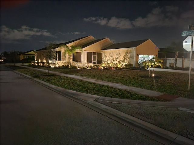 view of front of home with a garage and a front yard