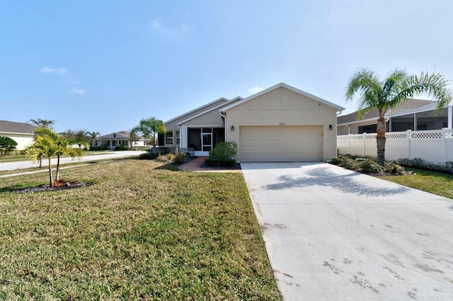 ranch-style house featuring a garage and a front yard