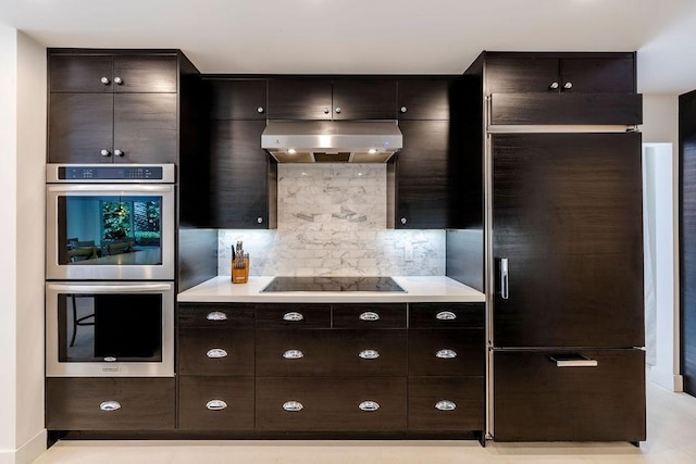 kitchen with black electric cooktop, stainless steel double oven, extractor fan, and dark brown cabinets