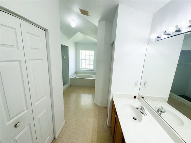 2054 14th Ave SW, Vero Beach, FL 32962 - full bath featuring a garden tub, baseboards, vanity, and a closet