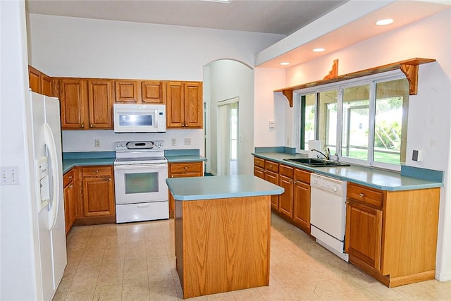 2054 14th Ave SW, Vero Beach, FL 32962 - kitchen with white appliances, a sink, brown cabinetry, and recessed lighting