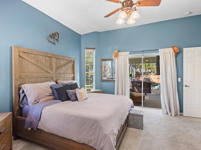 bedroom featuring multiple windows, access to exterior, and light colored carpet