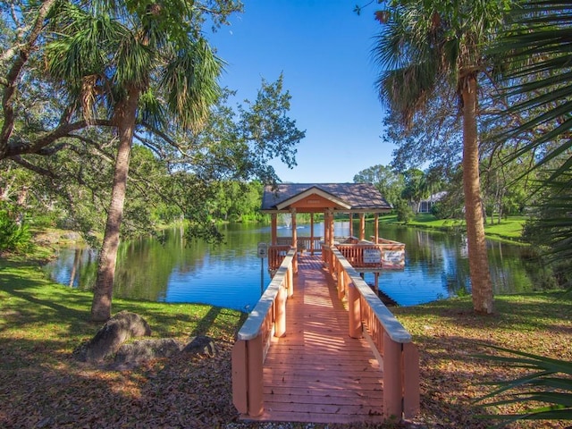 view of dock featuring a water view and a gazebo