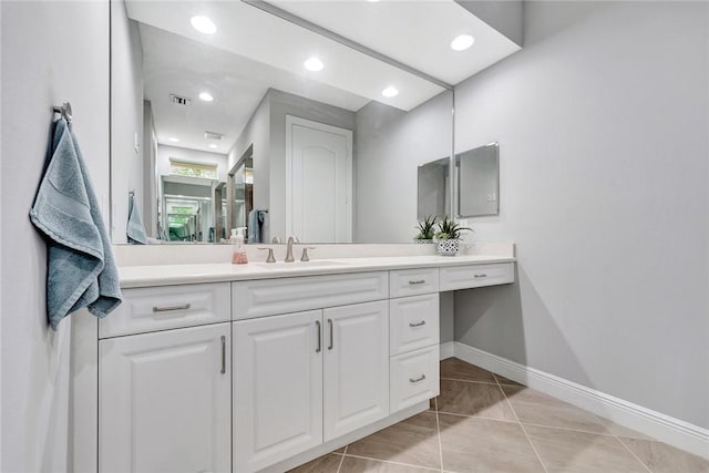 bathroom featuring tile patterned floors and vanity