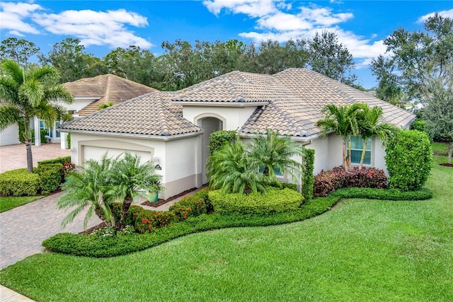 view of front of house with a front lawn and a garage