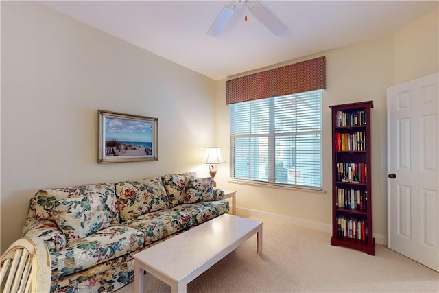 carpeted living room featuring ceiling fan