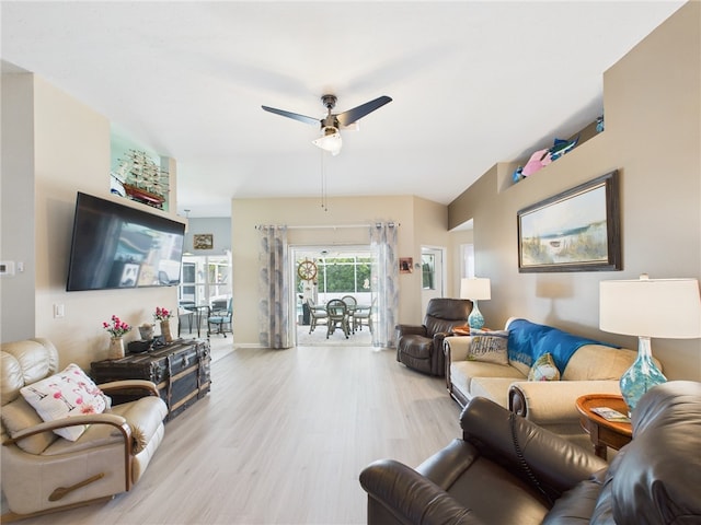 living area featuring a ceiling fan and light wood-type flooring