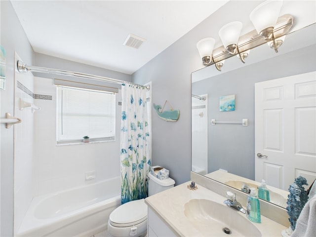 bathroom featuring vanity, toilet, visible vents, and shower / tub combo with curtain