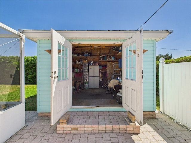 view of outbuilding with fence