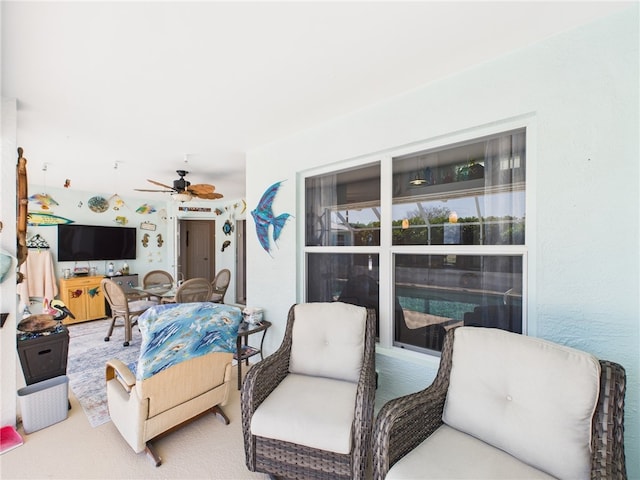 interior space featuring outdoor dining space and ceiling fan