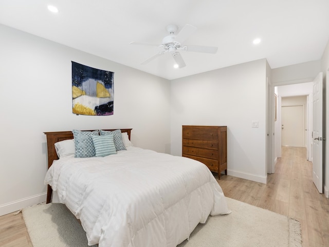 bedroom featuring ceiling fan and light hardwood / wood-style floors