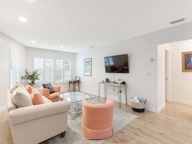 living room with light hardwood / wood-style flooring