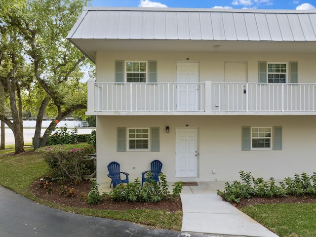 view of property with a balcony