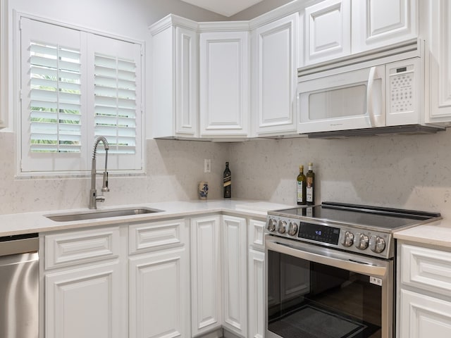 kitchen with white cabinets, sink, and stainless steel appliances