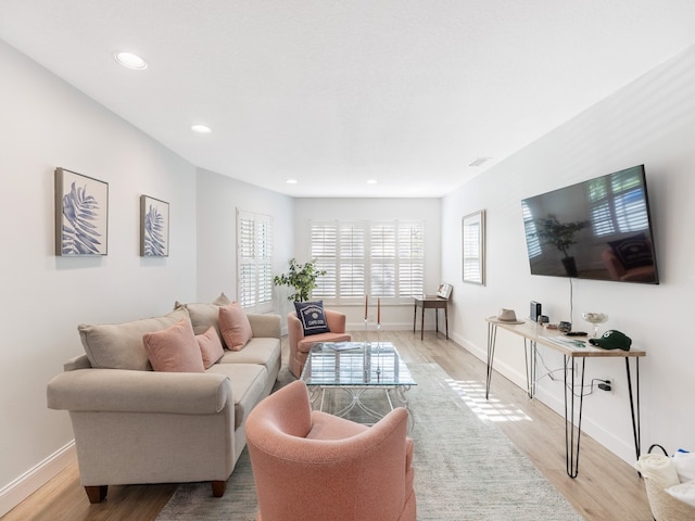 living room with light hardwood / wood-style flooring