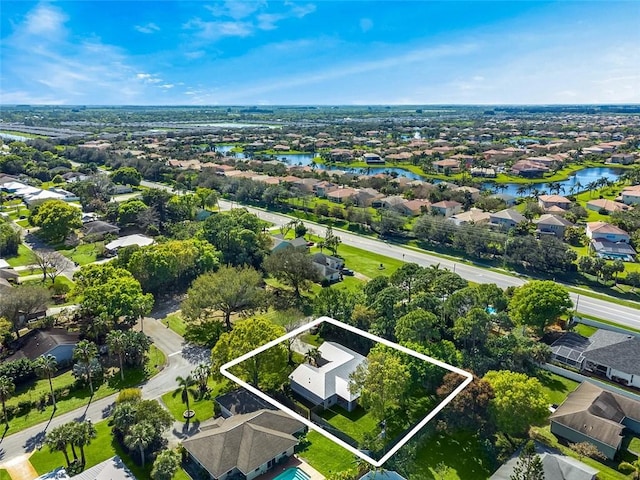 birds eye view of property featuring a water view and a residential view