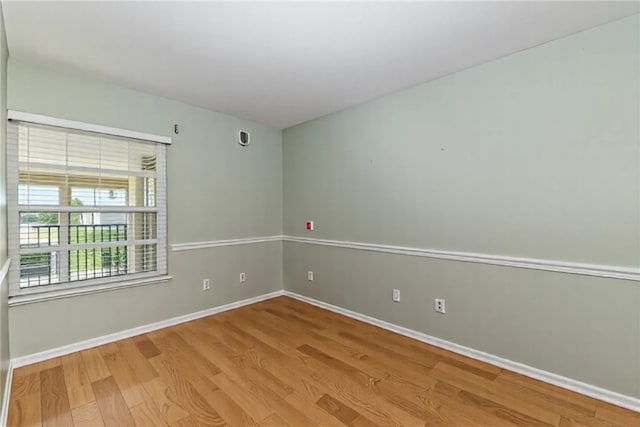720 Lake Orchid Cir Unit 202, Vero Beach, FL 32962 - unfurnished room featuring wood finished floors and baseboards