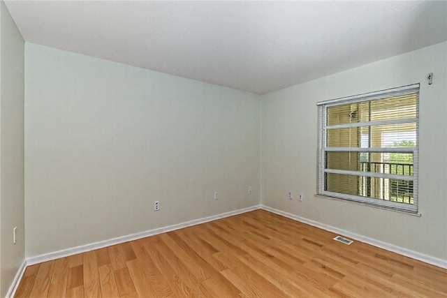 720 Lake Orchid Cir Unit 202, Vero Beach, FL 32962 - unfurnished room featuring light wood finished floors and baseboards