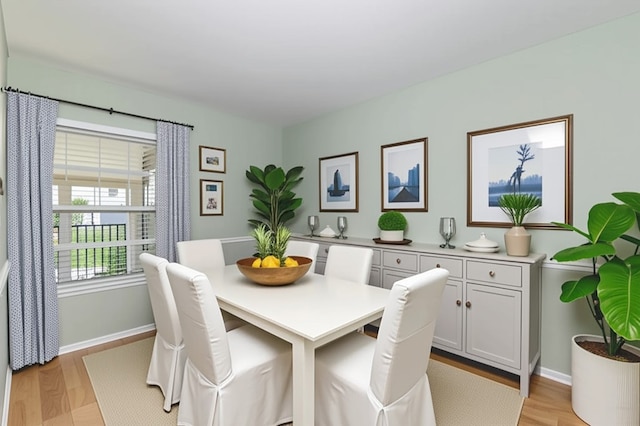 720 Lake Orchid Cir Unit 202, Vero Beach, FL 32962 - dining space featuring light wood-style flooring and baseboards