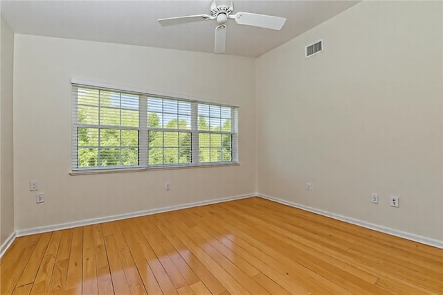 720 Lake Orchid Cir Unit 202, Vero Beach, FL 32962 - unfurnished room with light wood finished floors and a ceiling fan