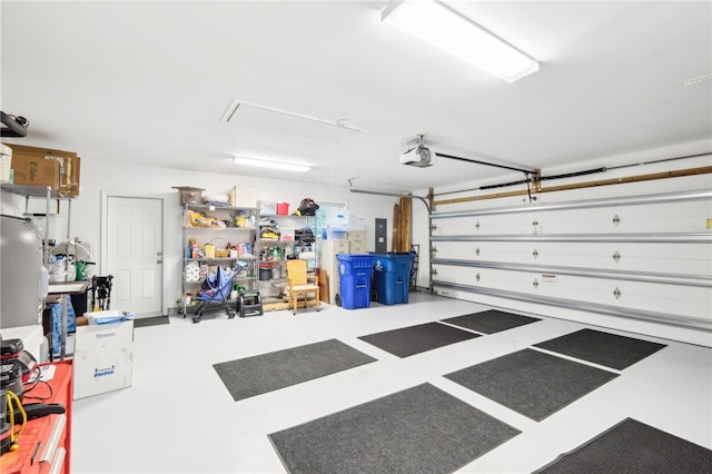 garage with electric panel and a garage door opener