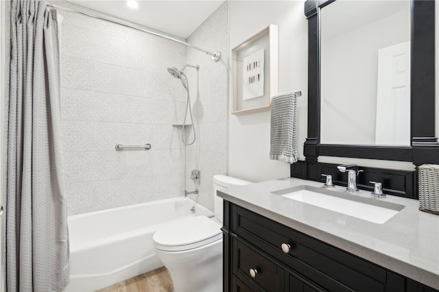 full bathroom with hardwood / wood-style floors, vanity, toilet, and shower / bathtub combination with curtain