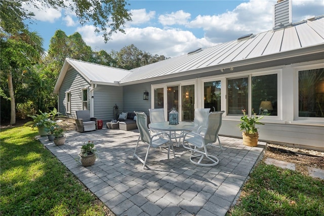 exterior space with outdoor lounge area and a patio