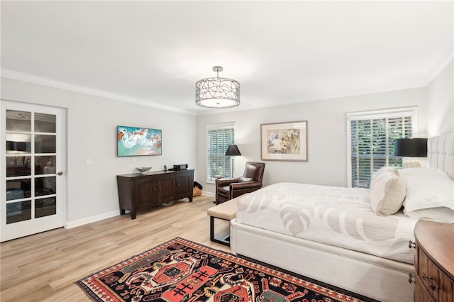 bedroom with light hardwood / wood-style flooring and ornamental molding