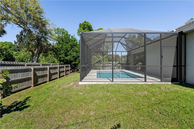 view of swimming pool featuring a patio, a fenced backyard, a yard, a fenced in pool, and a lanai