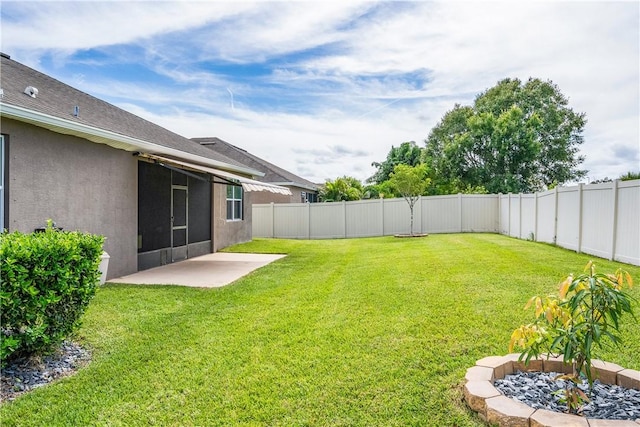 view of yard featuring a patio area and a fenced backyard