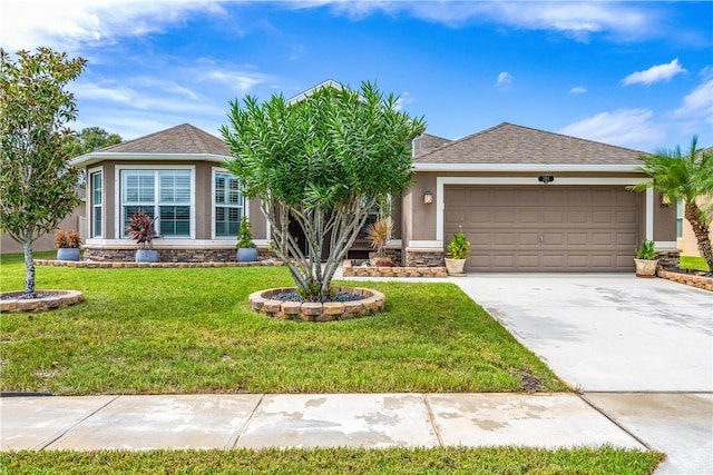 single story home with a front lawn, concrete driveway, an attached garage, stucco siding, and stone siding
