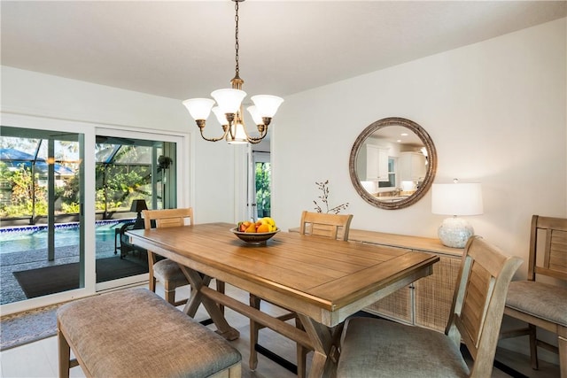 dining space with a notable chandelier