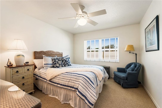 bedroom with light colored carpet and ceiling fan