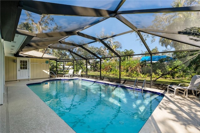 view of swimming pool with a lanai and a patio