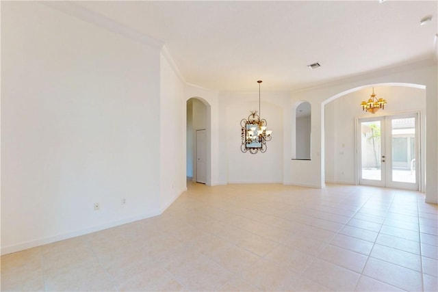 9515 E Maiden Ct, Vero Beach, FL 32963 - unfurnished room featuring arched walkways, a chandelier, visible vents, and light tile patterned floors