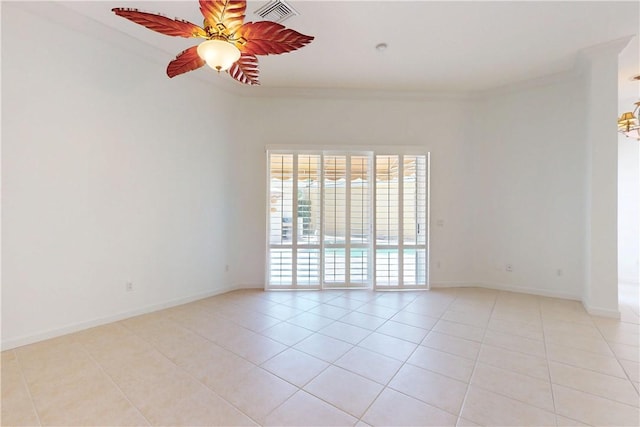 9515 E Maiden Ct, Vero Beach, FL 32963 - spare room featuring ornamental molding, visible vents, ceiling fan, light tile patterned floors, and baseboards