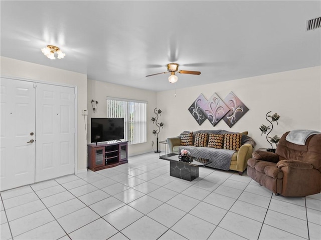 tiled living room featuring ceiling fan