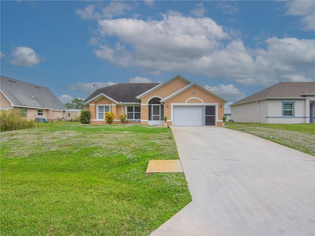 992 Seneca Ave, Sebastian, FL 32958 - ranch-style home with concrete driveway, an attached garage, a front lawn, and stucco siding