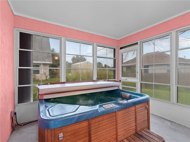 sunroom / solarium featuring plenty of natural light and a hot tub