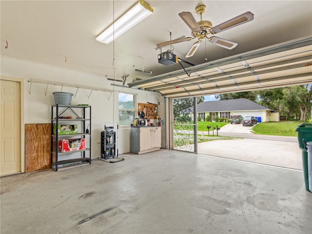 garage featuring ceiling fan and a garage door opener