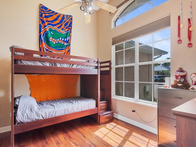 bedroom with light wood-type flooring and ceiling fan