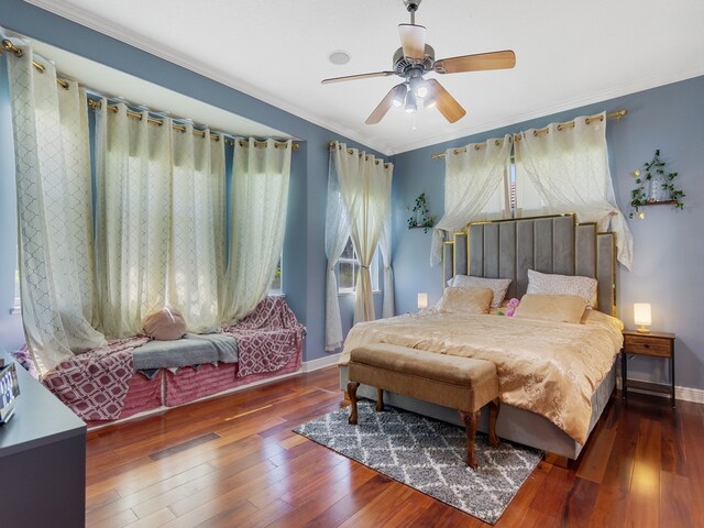 bedroom featuring ceiling fan, crown molding, and dark hardwood / wood-style flooring