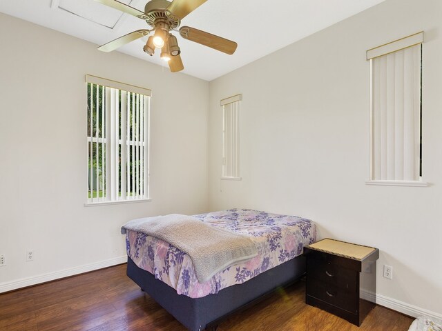 bedroom featuring dark hardwood / wood-style flooring and ceiling fan