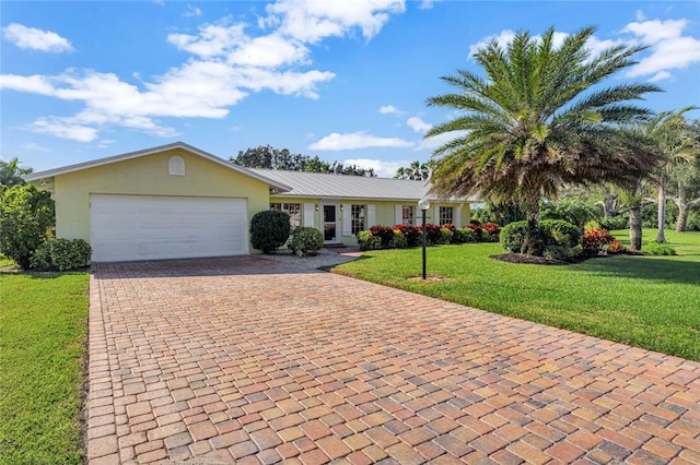 ranch-style house with a front yard and a garage