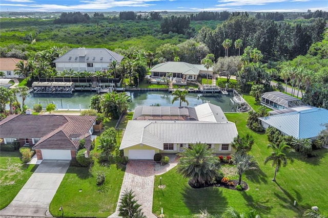 birds eye view of property with a water view