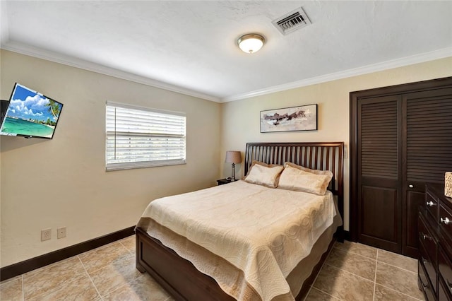 bedroom featuring light tile patterned floors and crown molding